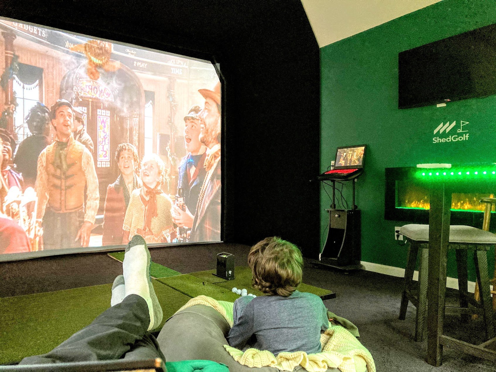 Not just a simulator — watching a movie on the big screen in a ShedGolf build